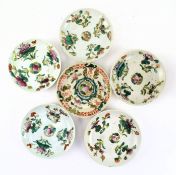 COLLECTION OF SIX QING DYNASTY FAMILLE ROSE SAUCERS