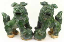 LARGE PAIR OF TANG STYLE GREEN GLAZED POTTERY GUARDIAN LIONS 绿釉狮子一对