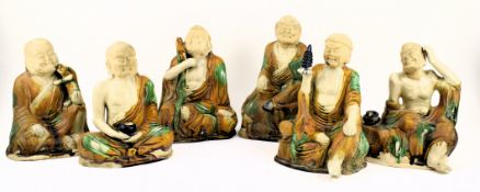A GROUP OF SIX SANCAI GLAZED POTTERY FIGURES OF LUOHANS 三彩罗汉