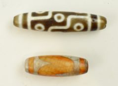 TWO TIBETAN AGATE DZI BEADS 九眼天珠和虎牙天珠