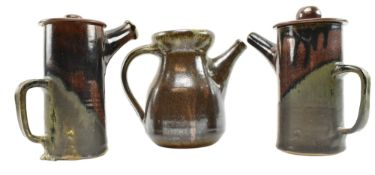 THREE RAKU GLAZED LIDDED TEAPOTS, ONE THE FRIARY AYLESFORD