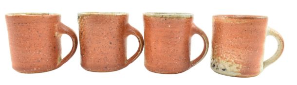 LISA HAMMOND FOR MAZE HILL POTTERY - FOUR STUDIO POTTERY STONEWARE MUGS, SODA SHINO GLAZE