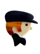 LEA STEIN CELLULOID GAVROCHE CHAUFFEUR BROOCH