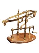 20TH CENTURY VINTAGE BRASS MECHANICAL WINE DECANTING CRADLE