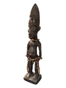 20TH CENTURY NIGERIAN YORUBA IBEJI CARVED WOODEN FIGURE