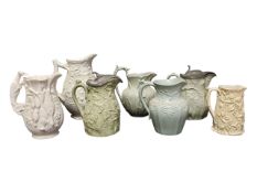 COLLECTION OF SEVEN 19TH CENTURY RELIEF MOULDED CERAMIC JUGS