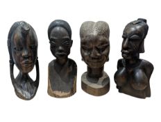 FOUR 20TH CENTURY CARVED HARDWOOD AFRICAN FEMALE BUSTS