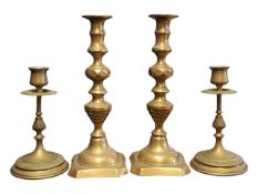TWO PAIRS OF 19TH CENTURY VICTORIAN BRASS CANDLESTICK HOLDERS