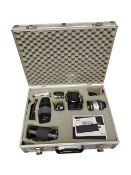 1980S RICOH XR 7 CAMERA AND VARIOUS LENSES HOUSED WITHIN A SILVERED BRIEFCASE
