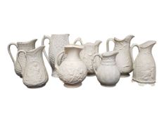 COLLECTION OF EIGHT 19TH CENTURY VICTORIAN RELIEF MOULDED STONEWARE JUGS