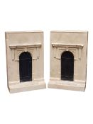 A PAIR OF LATE 20TH CENTURY TIMOTHY RICHARDS COMPOSITION FASCADE BOOKENDS