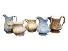 FIVE 19TH CENTURY VICTORIAN DRABWARE RELIEF MOULDED JUGS