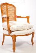 A 20TH CENTURY WALNUT LOUIS STYLE BERGERE CHAIR