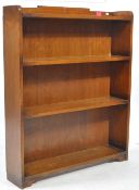 OAK OPEN FOUR SHELF BOOKCASE WITH RAISED DETAIL TO GALLERIED TOP