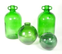 TWO VINTAGE GREEN GLASS DEMIJOHN BOTTLES
