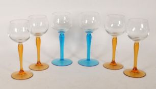 SIX LATE 20TH CENTURY VINTAGE WINE GLASSES WITH COLOURED STEMS