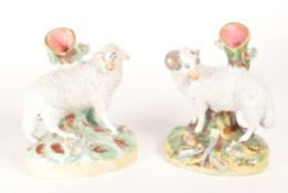 PAIR OF STAFFORDSHIRE 19TH CENTURY PORCELAIN SHEEP SPILL VASES