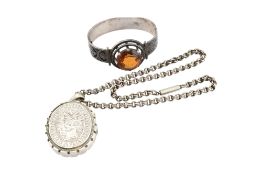 A Victorian locket chain and silver and citrine bangle. The hinged bangle set with a large round cut