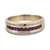 An 18ct gold ruby and diamond band ring. The ring with a central band of round cut rubies framed