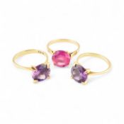 THREE 18CT GOLD COLOURED SINGLE STONE RINGS