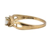 A hallmark 9ct gold and CZ ring. The ring set with a heart cut CZ to a Celtic style openwork head.