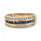 A 10K SAPPHIRE & DIAMOND HALF ETERNITY RING
