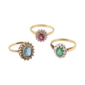 THREE HALLMARKED 9CT GOLD GEM SET HALO RINGS