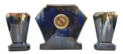 EARLY 20TH CENTURY 1930S ART DECO CERAMIC CLOCK GARNITURE SET IN MOTTLED BLUE AND BROWN
