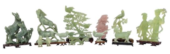COLLECTION OF TWELVE CHINESE JADE COLOURED FIGURES INCLUDING A DEITY