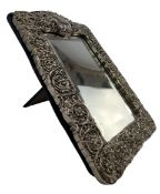 20TH CENTURY WHITE METAL REPOUSSE FRAMED DRESSING TABLE MIRROR