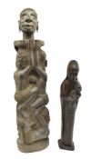 TWO 20TH CENTURY AFRICAN WOOD CARVINGS - FAMILY TREE & VIRGIN & A CHILD