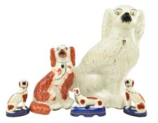 FIVE VICTORIAN 19TH CENTURY STAFFORDSHIRE POTTERY DOGS