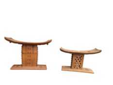 TWO 20TH CENTURY CARVED TRIBAL HARDWOOD PILLOWS