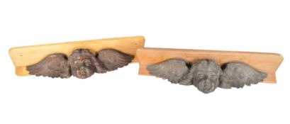 A PAIR OF 20TH CENTURY BOOKCASE SHELVES WITH NEO CLASSICAL CHERUB HEADS