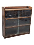 MANNER OF HERBERT GIBBS FURNITURE - MID CENTURY OAK BOOKCASE CABINET