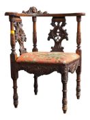 A 19TH CENTURY VICTORIAN CARVED OAK CORNER ARMCHAIR