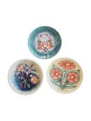 MOORCROFT - THREE 20TH CENTURY POTTERY PLATES