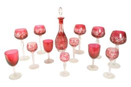 MID CENTURY CRANBERRY AND CLEAR GLASS INCL DECANTER AND GLASSES