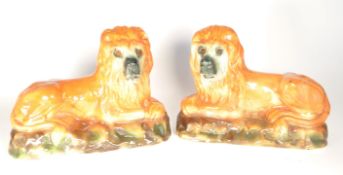 PAIR OF 19TH CENTURY STAFFORDSHIRE LIONS