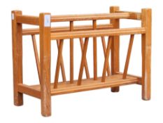 MANNER OF GUY ROGERS - MID CENTURY TEAK MAGAZINE RACK