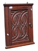 EARLY 20TH CENTURY CARVED OAK CORNER CABINET