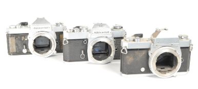 NIKON - THREE VINTAGE 20TH CENTURY 35MM SLR CAMERAS
