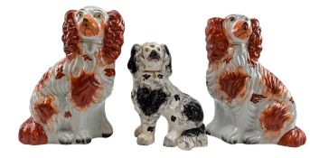 THREE STAFFORDSHIRE POTTERY 19TH CENTURY SPANIEL DOG FIGURES