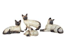 BESWICK - COLLECTION OF FOUR POTTERY CERAMIC SIAMESE CATS