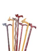COLLECTION OF INTAGE 20TH CENTURY WOODEN CARVED DRAGON HEADED WALKING STICKS