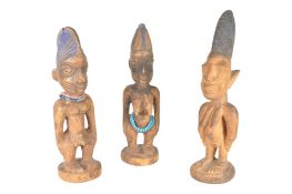 THREE 20TH CENTURY NIGERIAN IBEJI WOODEN FIGURES