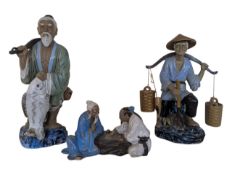 THREE 20TH CENTURY CHINESE MUDMEN POTTERY FIGURINES