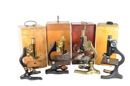 COLLECTION OF FOUR 20TH CENTURY MICROSCOPES IN ORIGINAL CASES