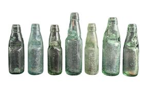 SEVEN LATE 19TH & EARLY 20TH CENTURY GLASS ADVERTISING CARBONATED CODD BOTTLES