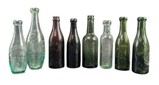 COLLECTION OF EIGHT EARLY 20TH CENTURY VINTAGE ADVERTISING GLASS BOTTLES